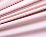 Microfibra Ramatex | Base - Toque Macio e Versátil para Lingerie - Evelin Tecidos Rolo de tecido de microfibra Ramatex na cor base, com toque suave e acabamento fosco, ideal para a fabricação de lingerie, moda íntima e peças confortáveis.