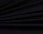 Microfibra Ramatex | Preta - Toque Macio e Essencial para Lingerie - Evelin Tecidos Rolo de tecido de microfibra Ramatex na cor preta, com toque suave e acabamento fosco, ideal para a fabricação de lingerie, moda íntima e peças confortáveis.