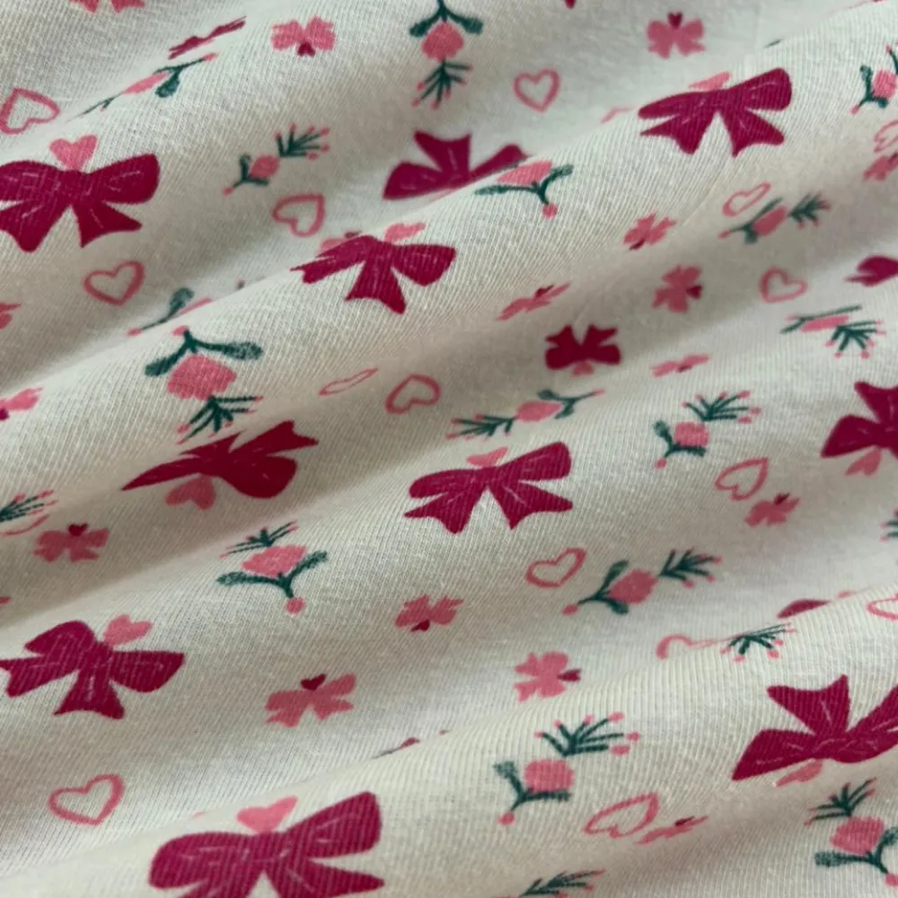 Tecido Cotton Lacinho Pink Fundo Off-White Evelin Tecidos.